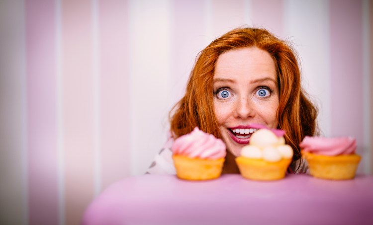 Young Woman Really Wants To Eat Cupcakes